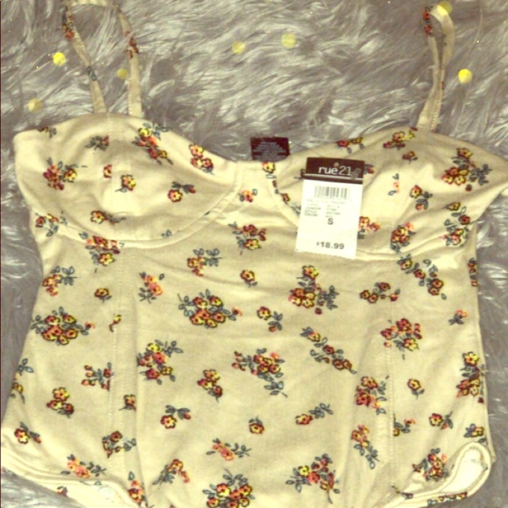 Cream flowered body suit.